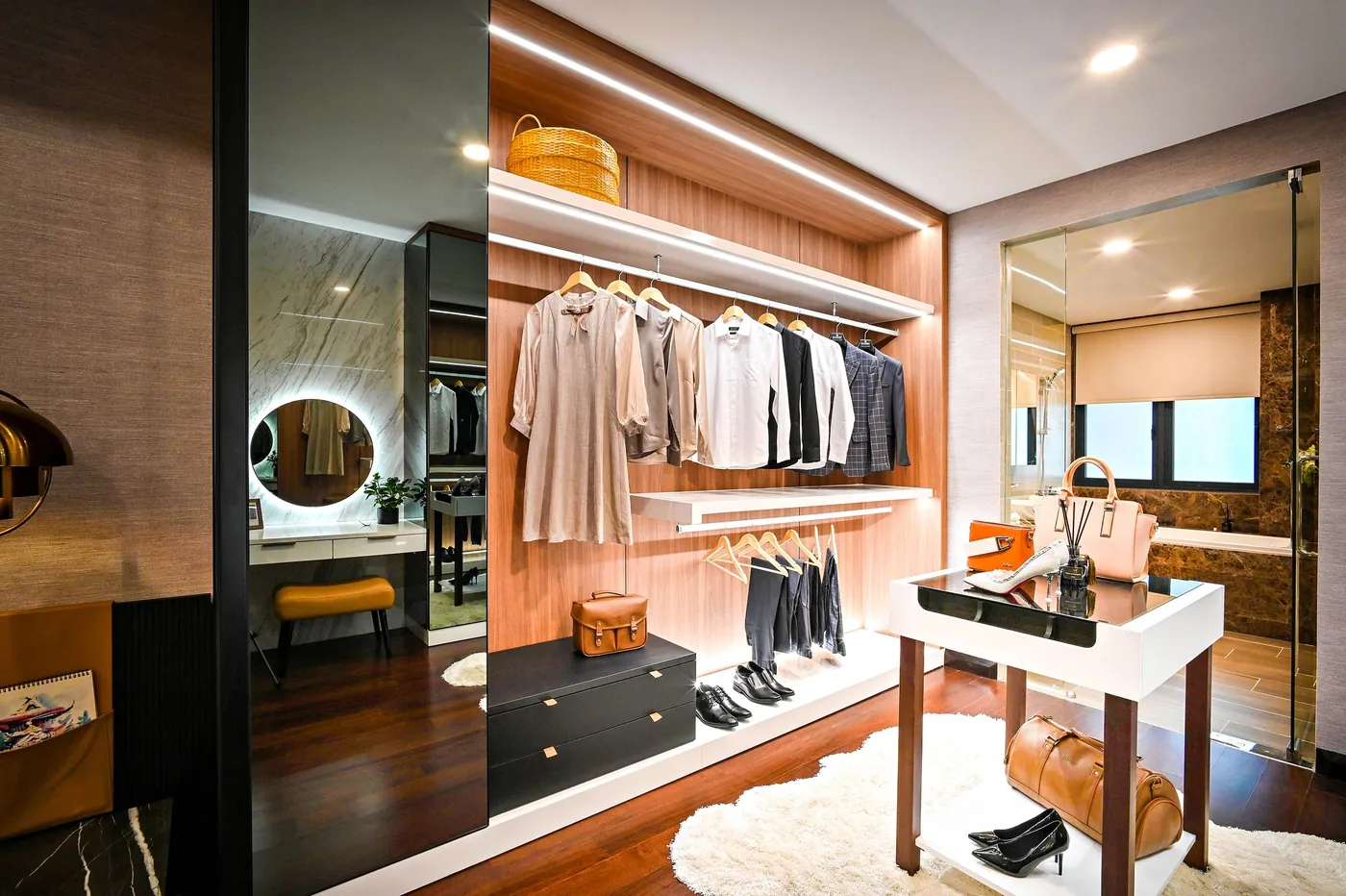 Dressing room with lit shelving and a vanity mirror